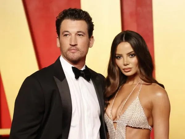 Miles Teller with wife